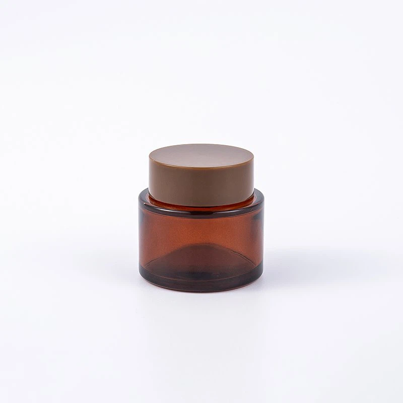 Rjavi stekleni kozmetični kozarec